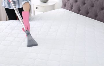 bigstock-Woman-Disinfecting-Mattress-Wi-283992901